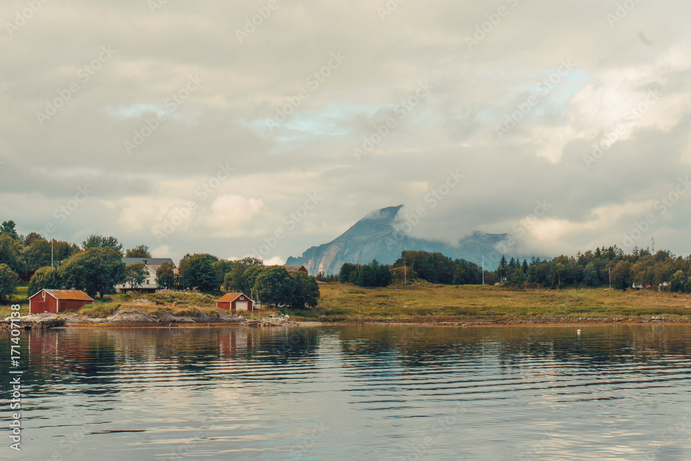 Northern Norway landscapes. Cloudly sky under the ocean. Mountains background. By Letowa. Northern Norway landscapes. Cloudly sky under the ocean. Mountains background. By Letowa.