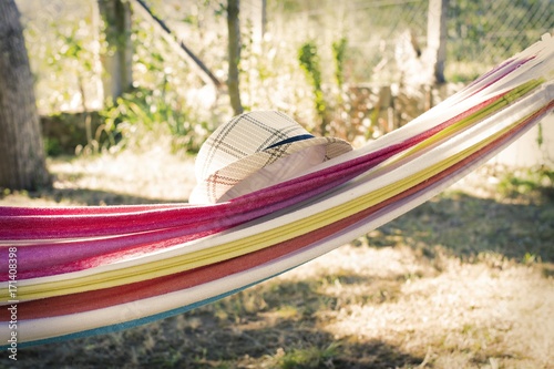 hammock with hat at sunset summer, holiday concept