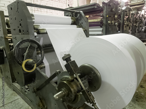 A roll of paper installed in a typographic machine.
