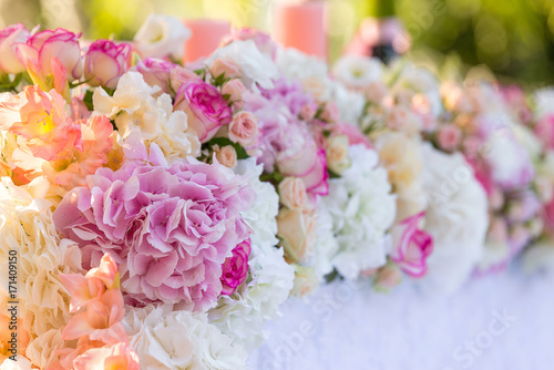 floral wedding decorations pink and white. Garland, candle, lace, bouquet