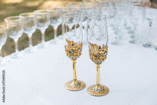 Empty wedding glasses. Set of pair crystal glasses