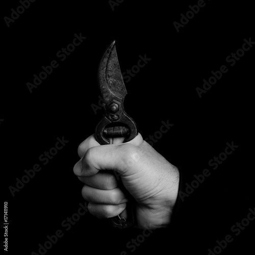 cropper - tools in a man's hand - black and white photo photo