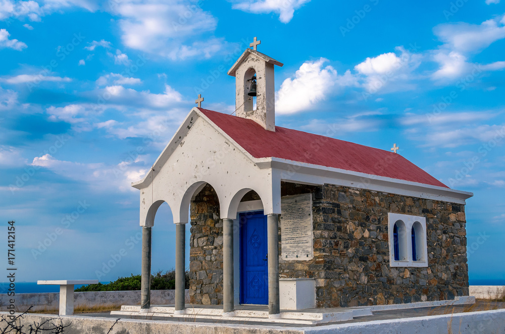 picturesque orthodox chapel on the top of the hill with stunning view the aegean sea  in north crete.