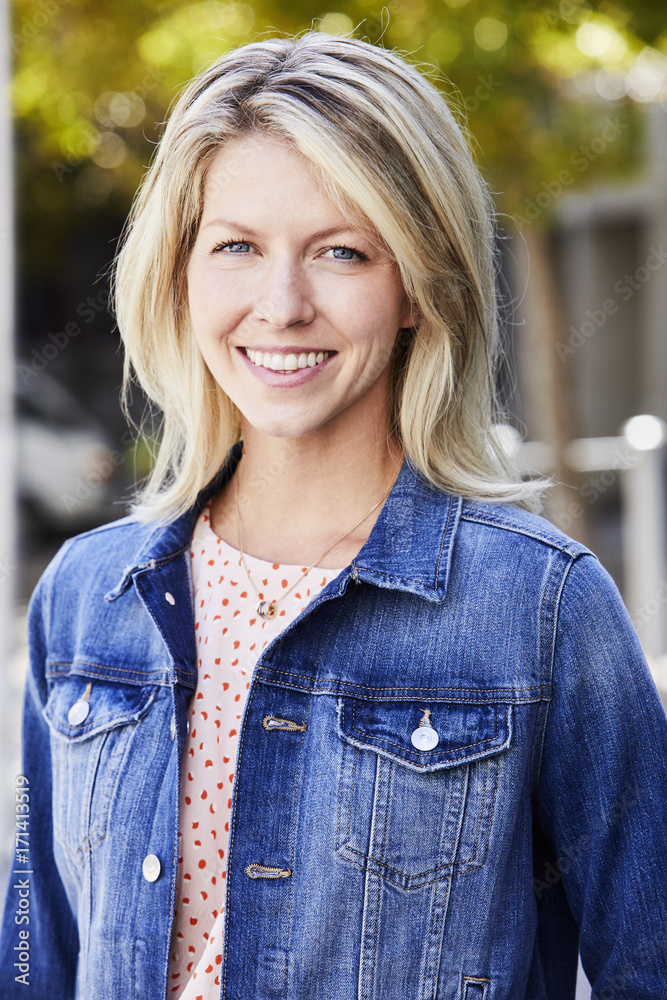 Blue eyed and beautiful woman smiling to camera Blue eyed and beautiful woman smiling to camera