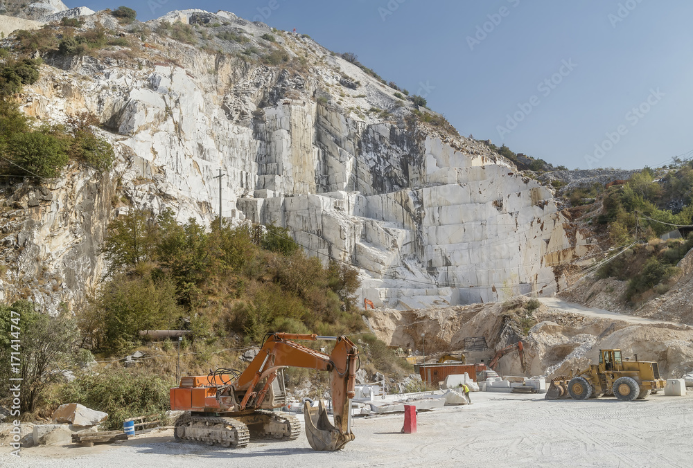 Lonely worker in a large marble quarry, Colonnata, Carrara, Tuscany, Italy Lonely worker in a large marble quarry, Colonnata, Carrara, Tuscany, Italy
