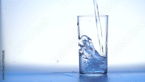 Pouring glass of water in slow motion high quality 
