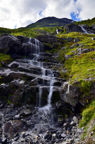 Scenic wild waterfall in Fjordlande  Hjorundfjord   Norway