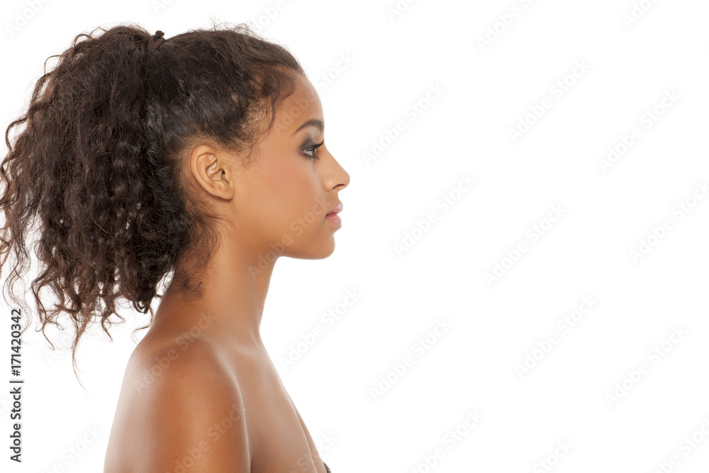 Profile of a beautiful young dark-skinned woman on a white background Profile of a beautiful young dark-skinned woman on a white background
