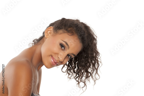 portrait of a happy young dark-skinned woman on a white background