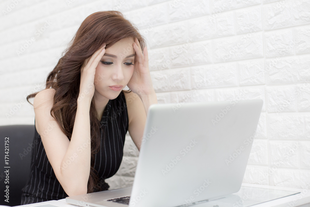 Asian Woman using Laptop with serious emotion, woman boring to work at laptop, woman working concept. Asian Woman using Laptop with serious emotion, woman boring to work at laptop, woman working concept.
