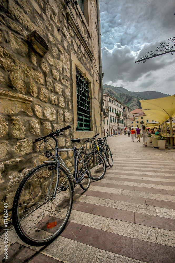 KOTOR, MONTENEGRO – JUNE 14, 2011: Bicycle in old town Kotor on the wall