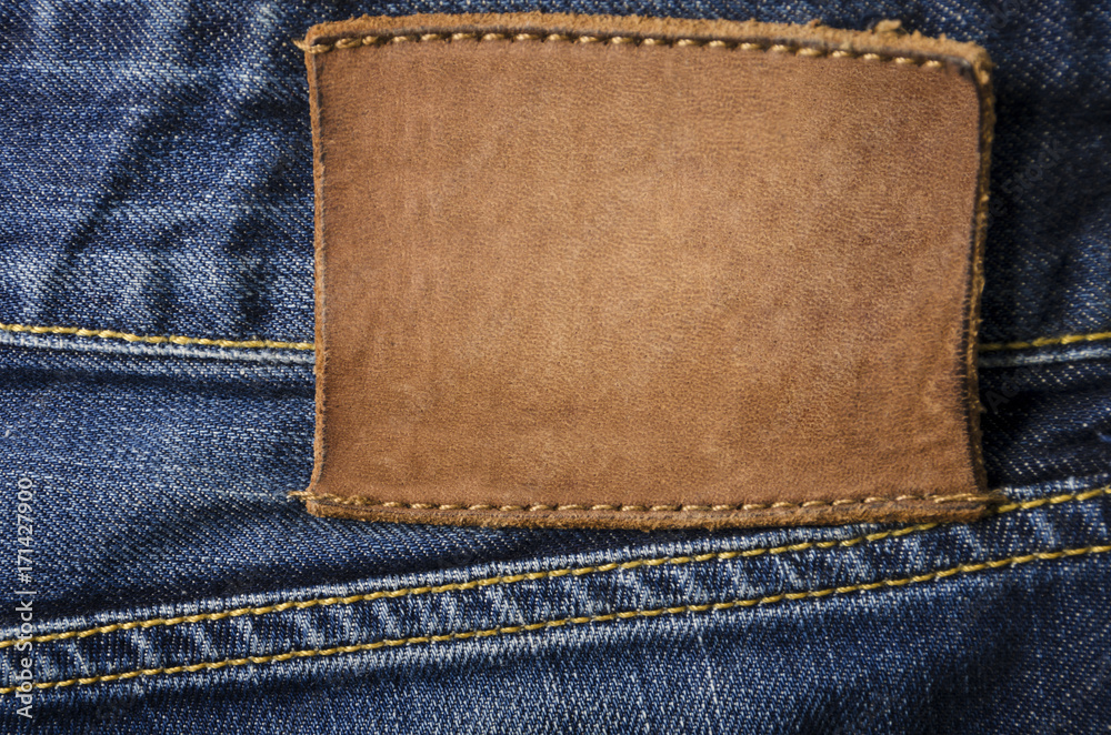 Blank leather jeans label sewed on a blue jeans Stock Photo | Adobe Stock