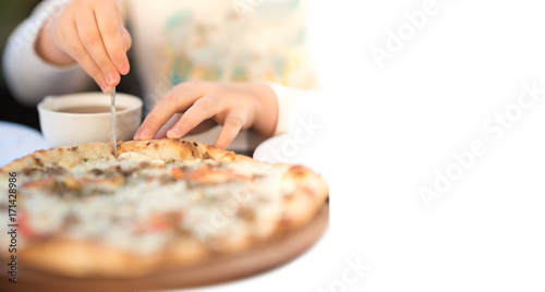 Pizza with four cheeses and mushrooms. Girl are cut and enjoy the pizza. copy space