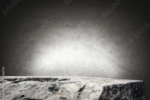 rock table background and gray dark wall space  photo