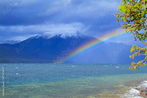 Rainbow over stormy lake