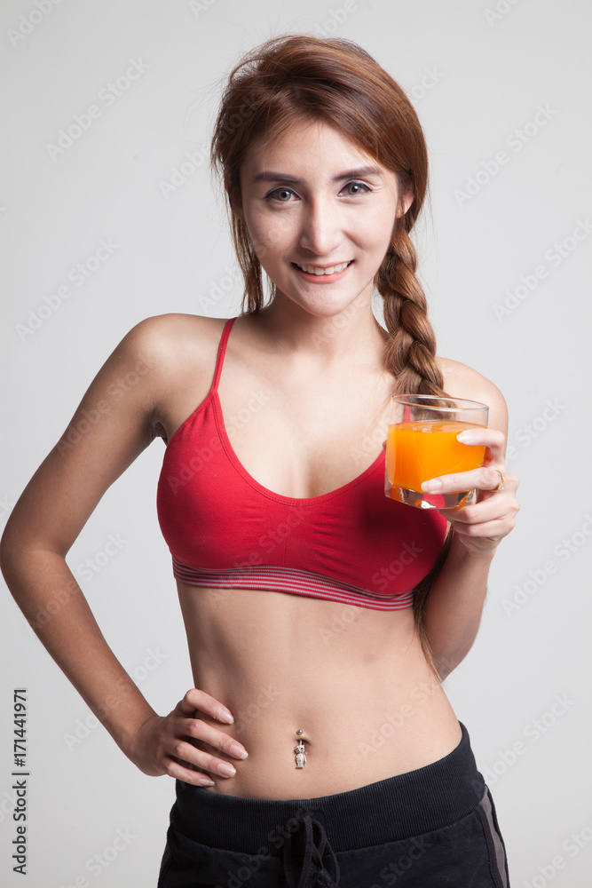 Beautiful Asian healthy girl drinking orange juice. Beautiful Asian healthy girl drinking orange juice.
