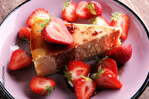 Homemade cheesecake with fresh strawberries and mint for dessert - healthy organic summer dessert pie cheesecake. Vanilla Cheese Cake.