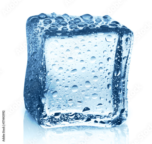 Transparent ice cube with reflection on white isolated background © Prostock-studio