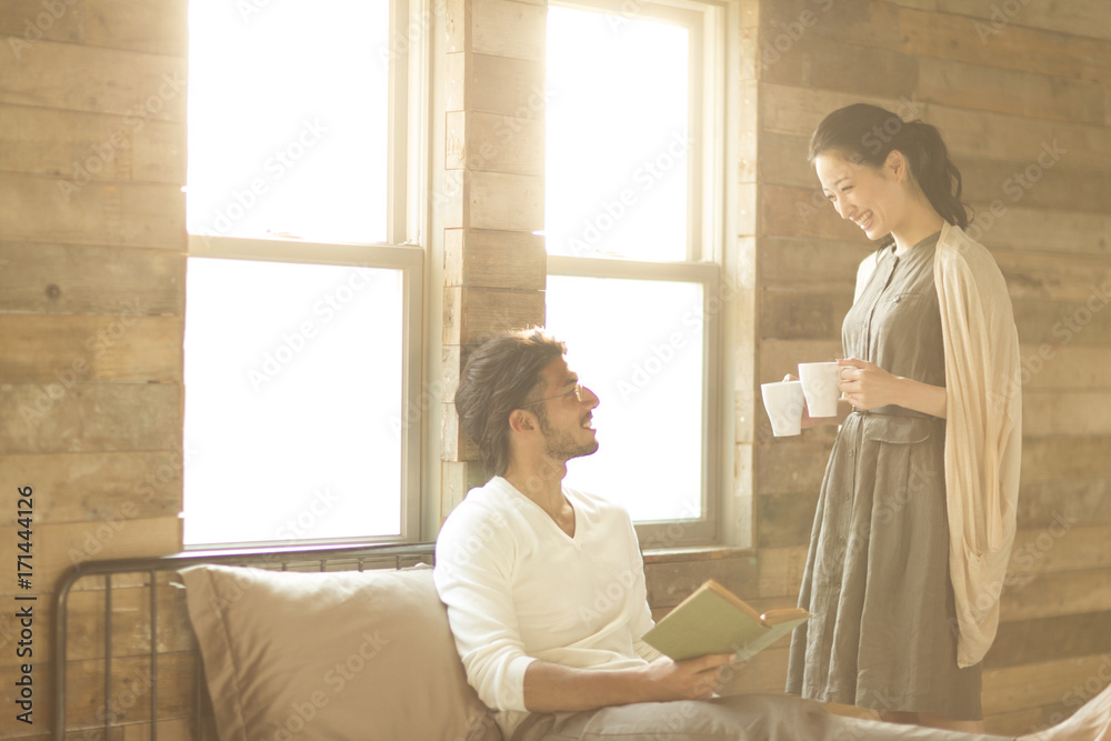 Woman giving a man a mug Woman giving a man a mug