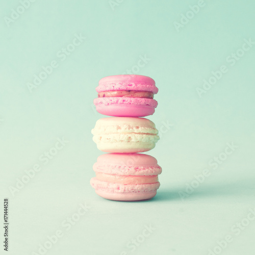 Tower of pastel french macarons over mint