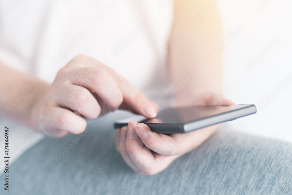 Woman texting on mobile phone