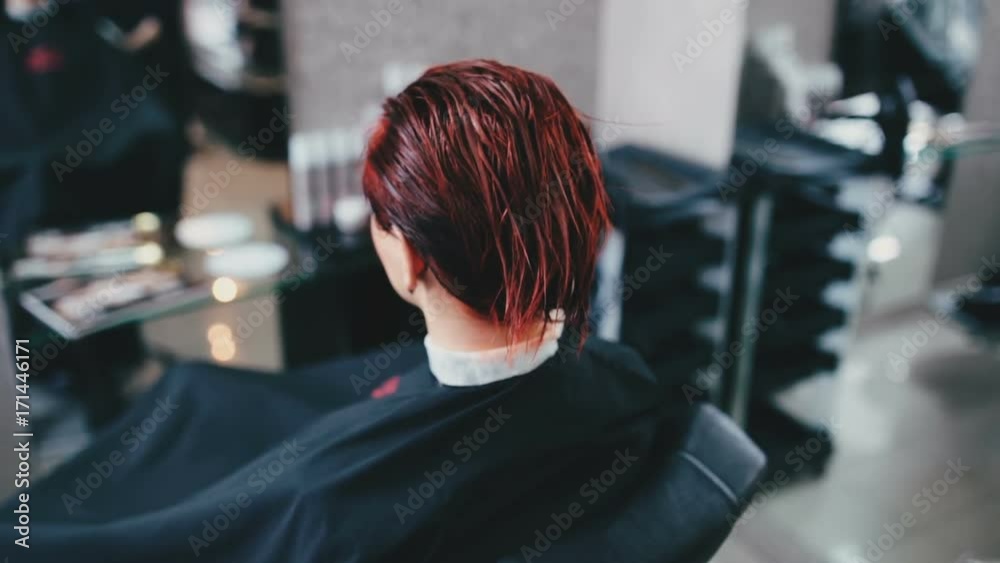 Hairdresser removes cellophane film from the client close up Hairdresser removes cellophane film from the client close up