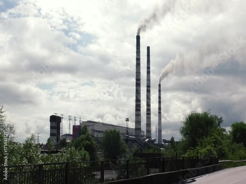 Thermal power plants. Pipes are emitting smoke in the air.