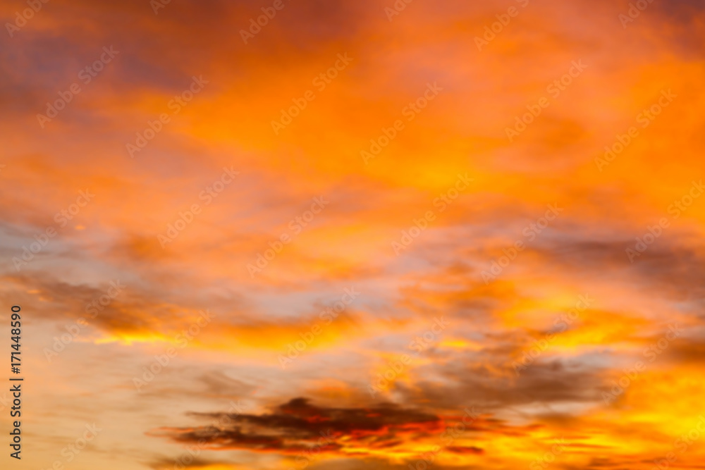 Dramatic sunrise sky with clouds.Blur or Defocus image. Dramatic sunrise sky with clouds.Blur or Defocus image.
