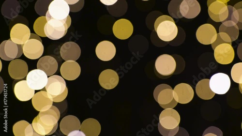 blurred chtistmas lights over dark background photo