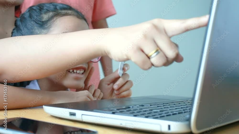 Family mother grandmother and dauhgter using laptop computer with holding credit card metaphor concept for online shopping and e commerce concept Family mother grandmother and dauhgter using laptop computer with holding credit card metaphor concept for online shopping and e commerce concept