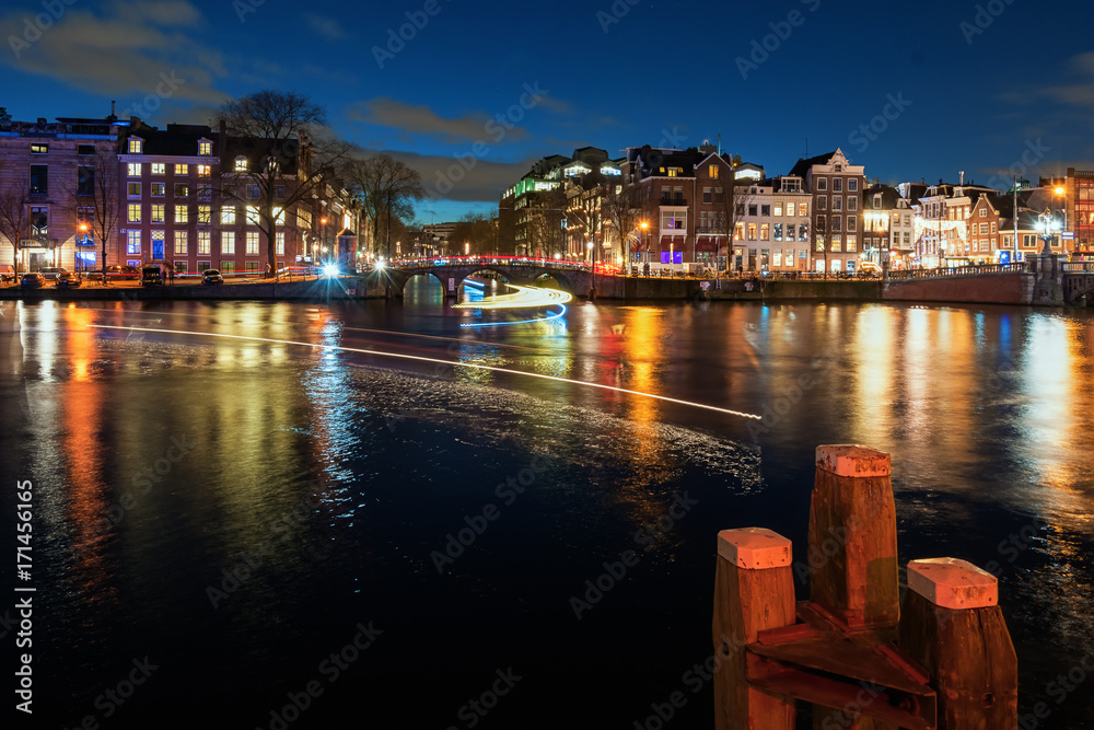 Bridge in the old town of Amsterdam in the evening