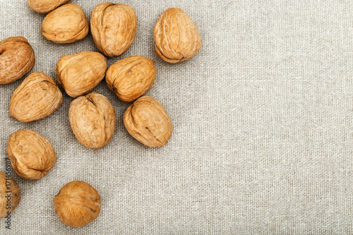 Food background with walnuts on cloth and copy space.