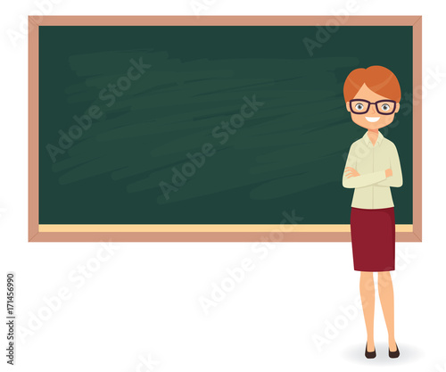 Young female teacher against a blackboard background