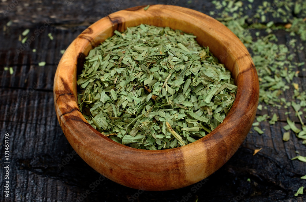 tarragon on wooden table tarragon on wooden table