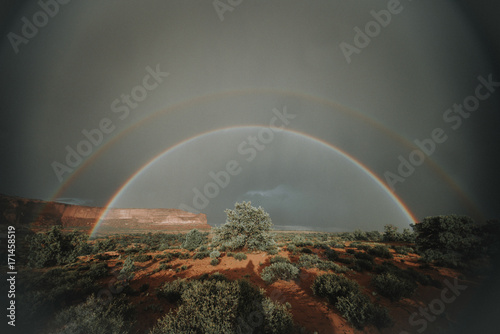 Scenic view of rainbows over landscape