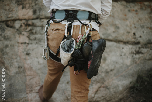 Rear view of man with climbing equipment