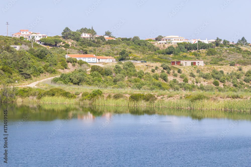 Fototapeta premium Houses, lake and trail in mountain in Arrifana