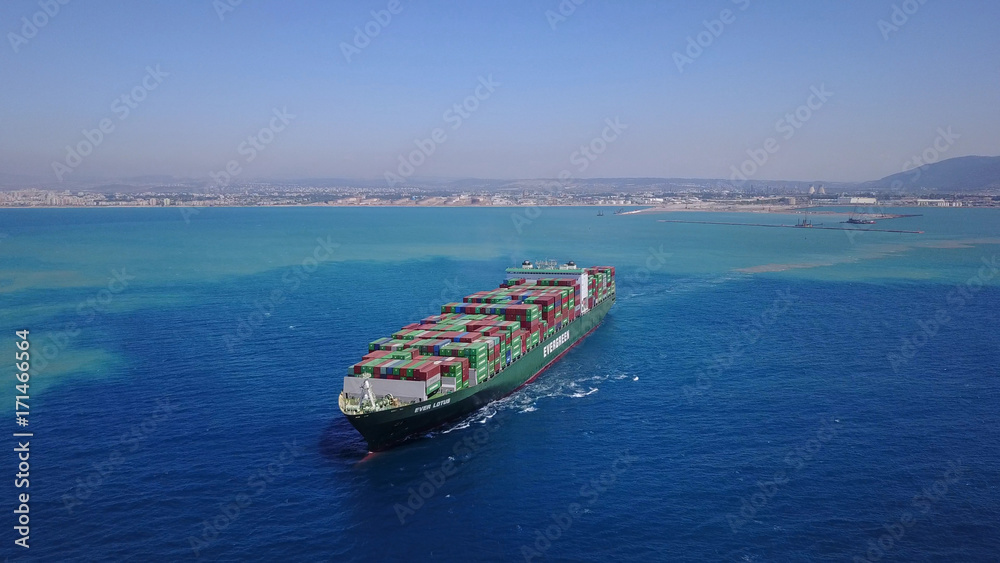 LARGE container ship fully loaded with containers and cargo - aerial 4k view top down