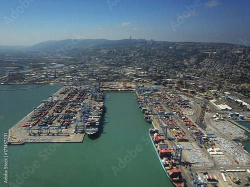 Fully loaded container ship docked at freight port terminal