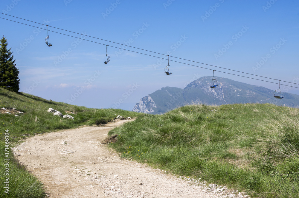 Touristic trail Alta Via del Monte Baldo, ridge way in Garda Mountains, cableway