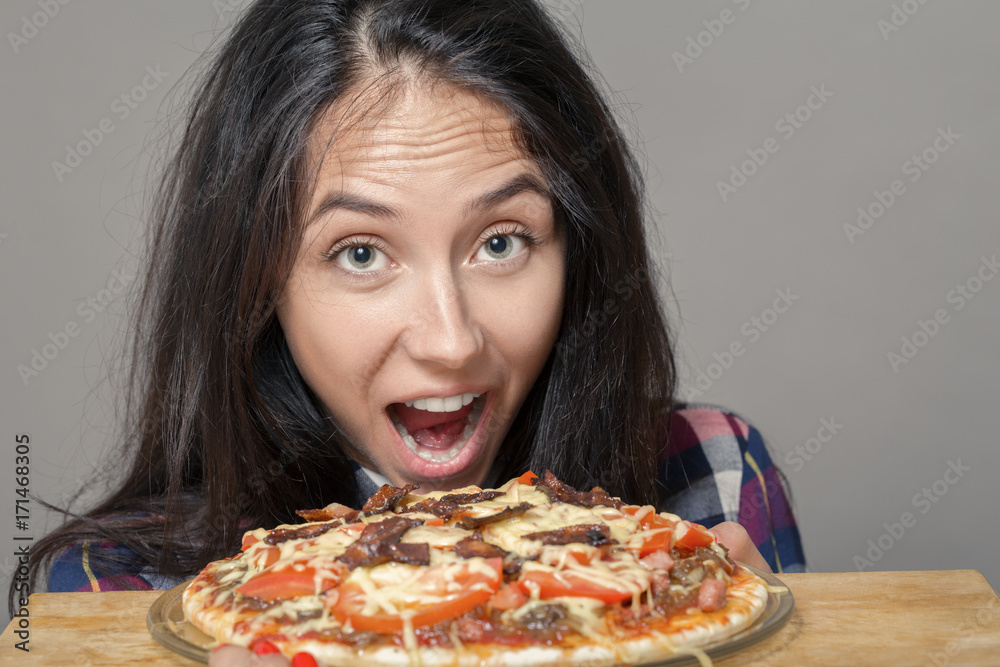 happy woman with pizza on white background