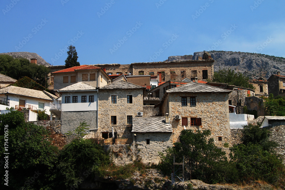 Stone buildings near famous Old bridge in Mostar , Bosnia and Herzegovina