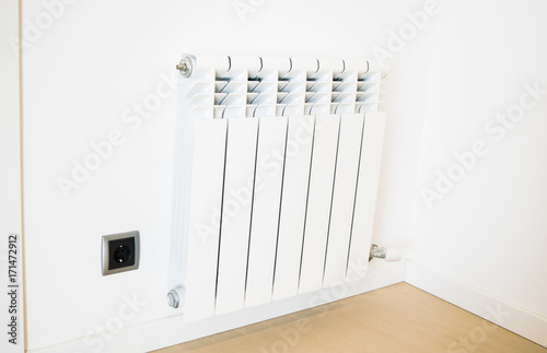 Wallpaper Mural New white heating radiator on the white wall in the apartment Torontodigital.ca