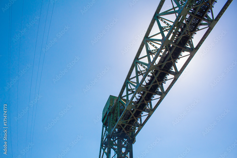 Photo of construction crane against blue sky