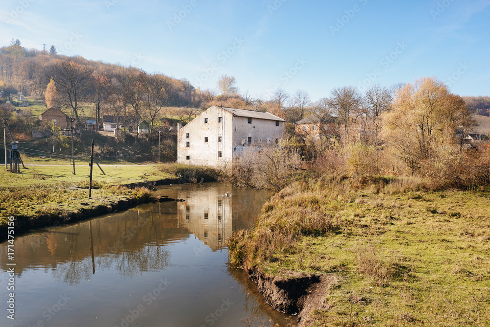 Autumn landscape of the countryside: old non-working watermill n Autumn landscape of the countryside: old non-working watermill n
