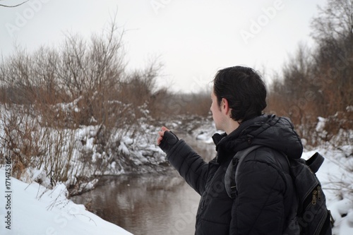 The guy on the background of the winter landscape