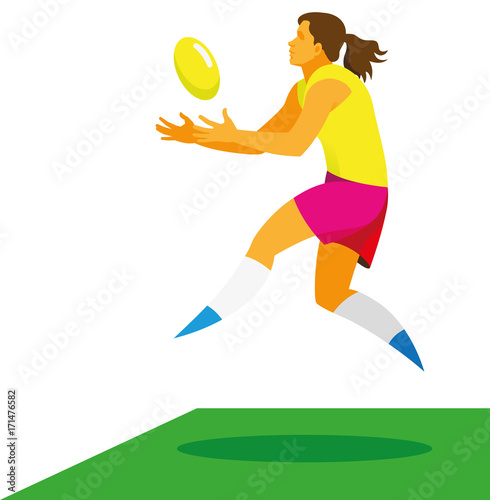 Young woman is a player of League Australian football who catches the ball in a jump