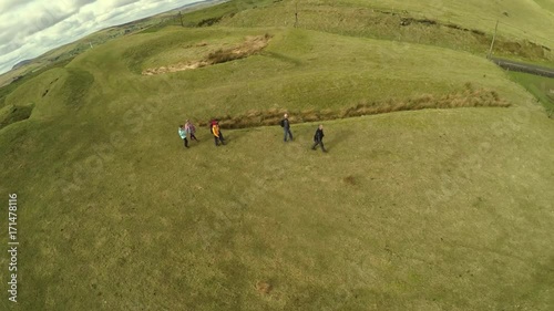 Tour guide and walkers at Knockdhu Barrows Northern Ireland photo