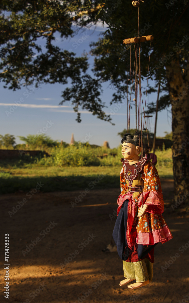 Traditional handicraft puppet is sold in a market in Bagan, Myanmar (Burma) Traditional handicraft puppet is sold in a market in Bagan, Myanmar (Burma)