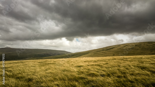 Scenic View Of Field Against Cloudy Sky